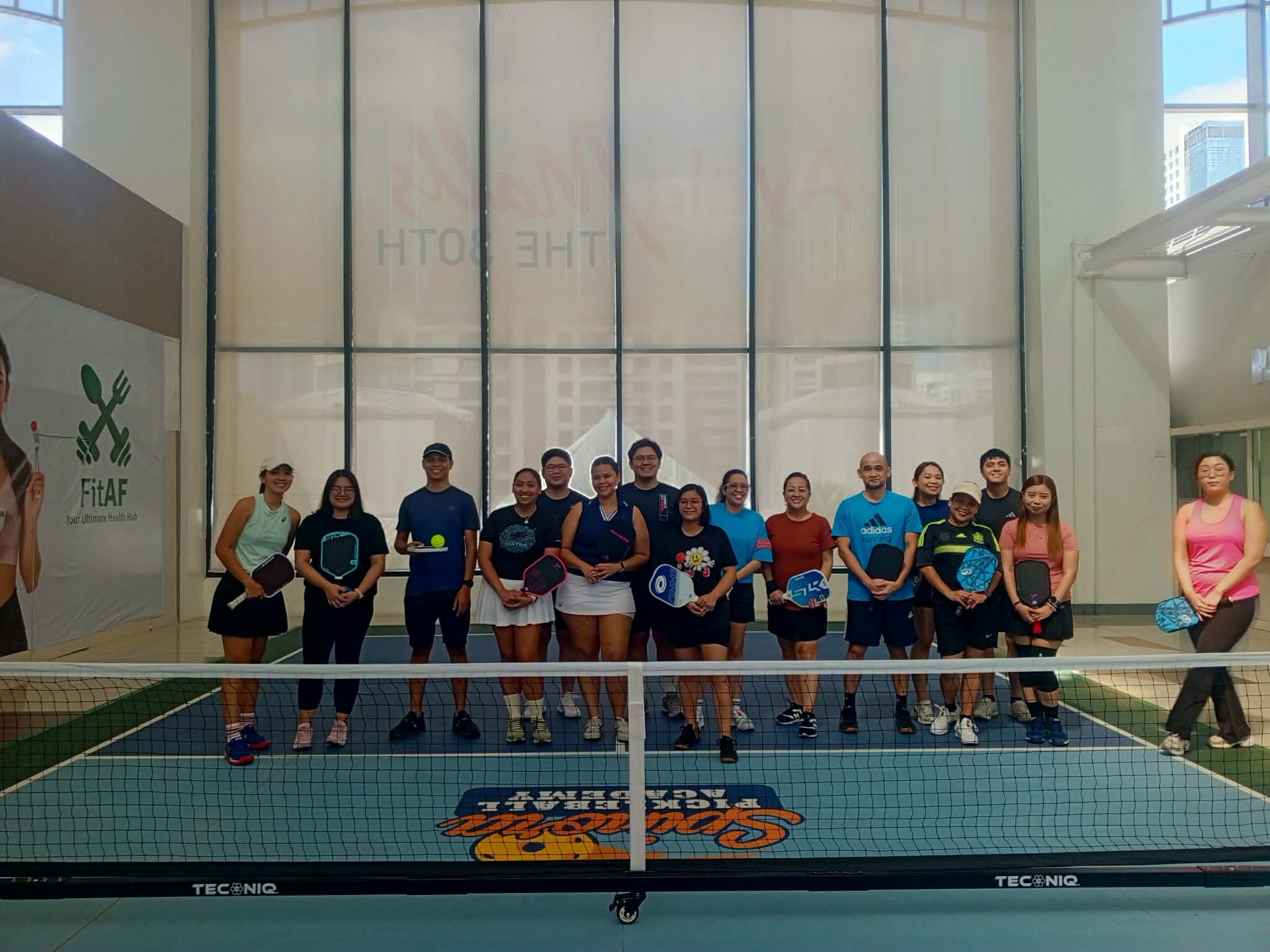 Friendly group playing pickleball